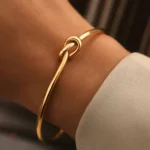 Bracelet jonc doré avec nœud pour femme tendance