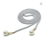 Perles et tressage : ceinture unique pour un look moderne