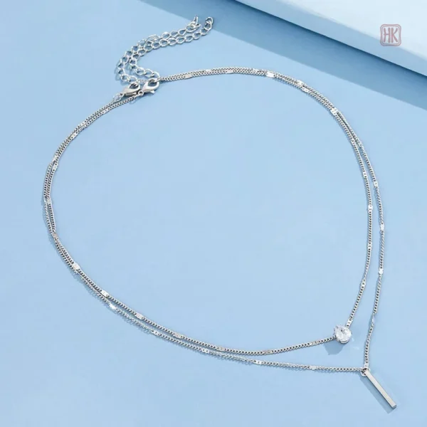 Bijou tendance avec double chaîne et pendentif élégant