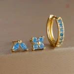 Ensemble de boucles d'oreilles dorées avec éclat