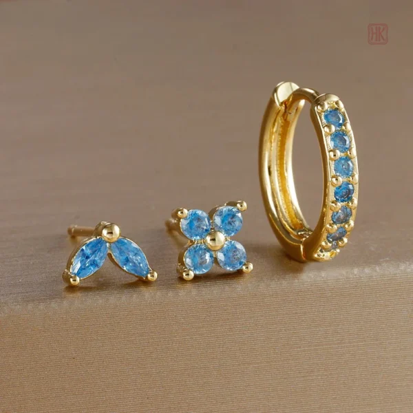 Ensemble de boucles d'oreilles dorées avec éclat